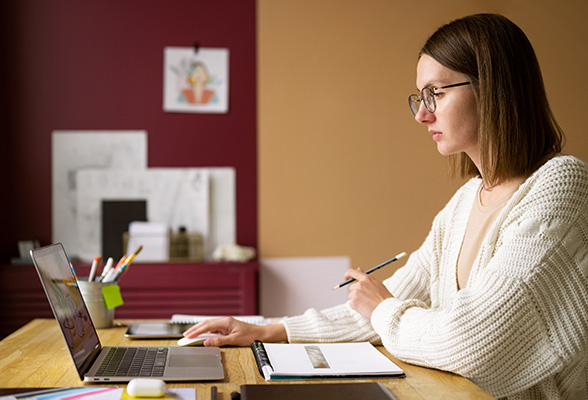 Hooman Writers academic expert working on a student’s homework assignment for reliable homework writing services.