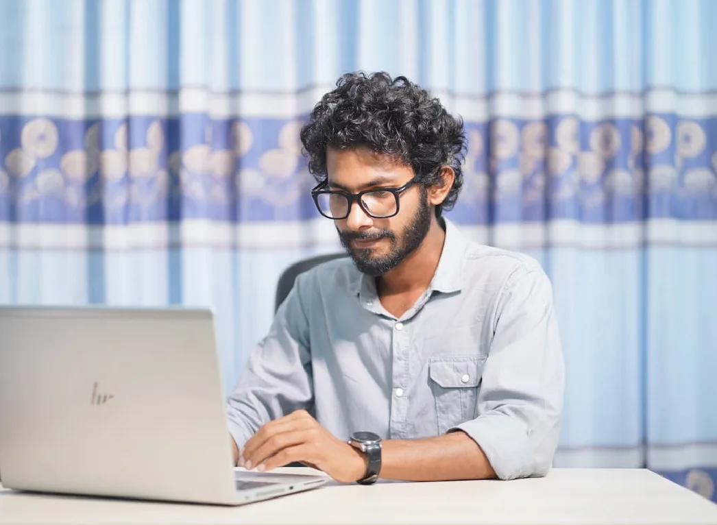 A PhD student working on his research paper.