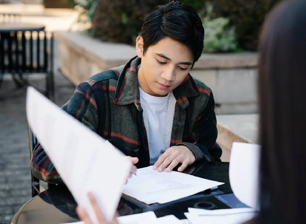 A mentor teaching her student to write a dissertation